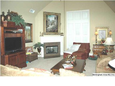 Spacious family room with soaring ceilings and a f