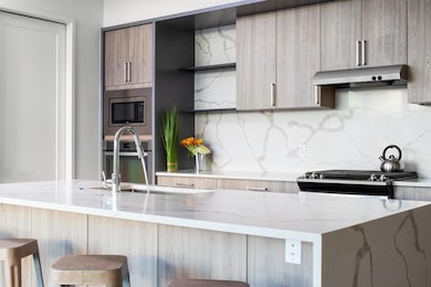 Kitchen featuring stainless steel appliances, mod