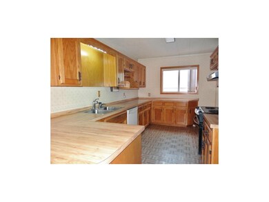 The kitchen features tons on counter space, plenty