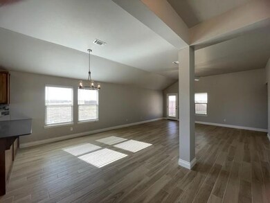 Unfurnished dining area featuring lofted ceiling, 