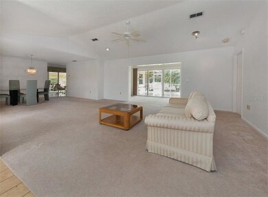 View as you enter, Florida room and lanai in backg