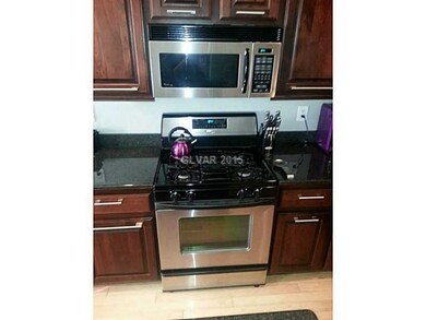 Property Photo. Stainless steel kitchen appliances