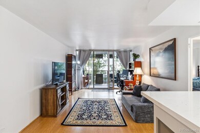 Living area w/ sliding glass door to balcony