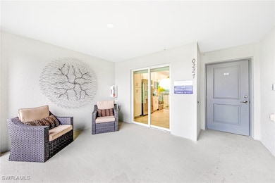 Living area featuring carpet flooring