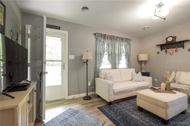 Living room with wood-type flooring
