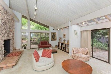 Living room with views to the back and side yards.