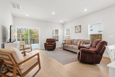The living room opens onto the deck and is filled with light and views.