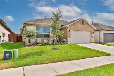 Ranch-style house with driveway, a garage, brick siding, and stone siding