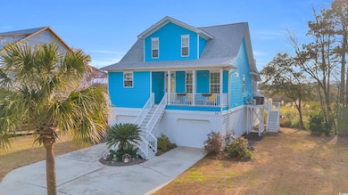 Coastal inspired home featuring a garage, central 