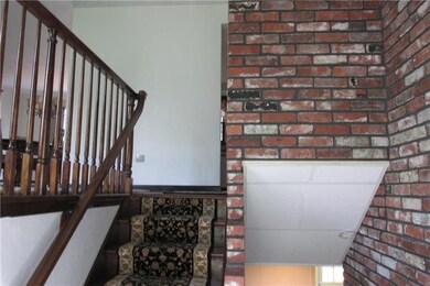 Entry from the front door, all brick wall entry