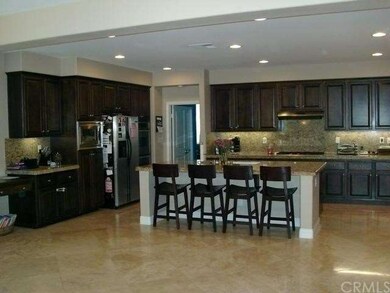 Huge Kitchen with island, desk area double ovens, 
