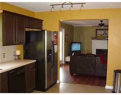 Kitchen. Kitchen opens to den and formal dining ar