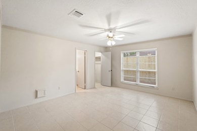 The primary bedroom welcomes you with bright natural light, fresh paint, ceiling fan, and ensuite bathroom! Plus the neutral ceramic tile throughout the room makes it easy to clean and maintain.