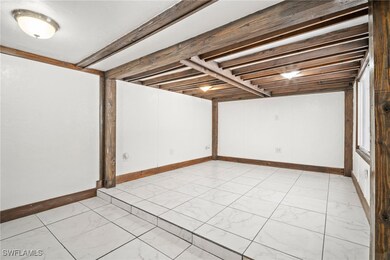 Finished below grade area featuring baseboards and