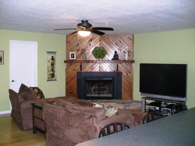 Family room with wood burning fireplace