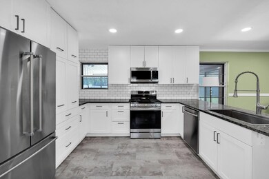 Kitchen with appliances with stainless steel finis