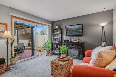 An entire wall of windows floods this living room in natural light