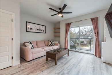 Living room with wood finished floors and a ceili