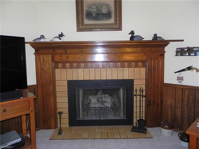 Lovely custom built fireplace is the focal point o
