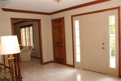 Entry with side windows and guest closet
