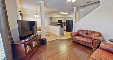Living area featuring decorative columns, ornament