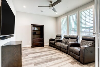 DOUBLE FRENCH DOORS LEAD INTO THE FLEXIBLE STUDY/TV ROOM.