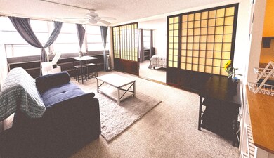 Living area  with shoji doors opening to bedroom