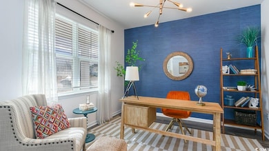 Virtually staged Office space featuring a chandelier and an accent wall