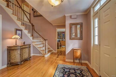 Check out the grand entryway with beautiful stairc