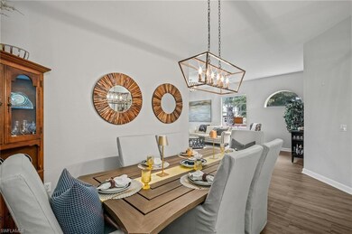 Dining space featuring a chandelier and wood finished floors