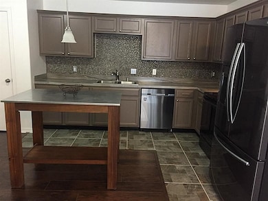 Modern kitchen equipped with stainless steel appli