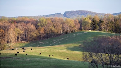 Property view of mountains with a rural view