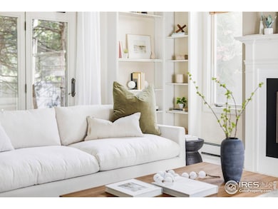 Step through the front door into a light-filled foyer with soaring ceilings, elegant architectural details, and a warm sense of welcome.