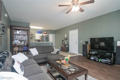 Living room featuring wood-type flooring and ceili