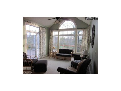 The sunroom room opens to a deck that overlooks a 