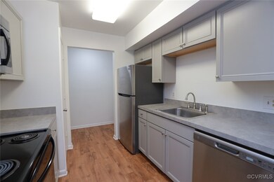 Kitchen with appliances, stainless steel finishes,
