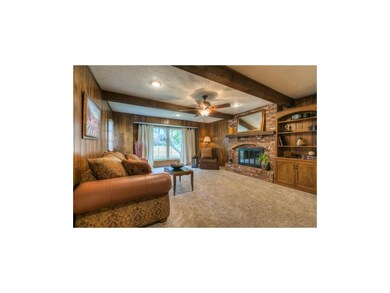 Large great room w. brick fireplace.