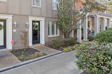 Entrance to property featuring brick siding