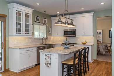 Remodeled kitchen with granite counters, shaker-st