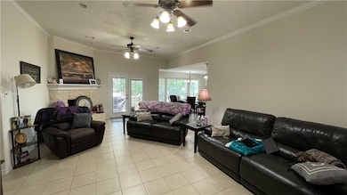 Living area featuring light tile patterned floors,