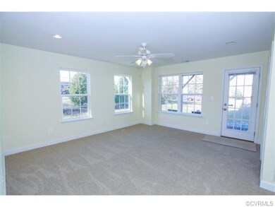 First floor recreation room offers new carpet, recessed lighting, and en-suite full bath with walk-in shower.