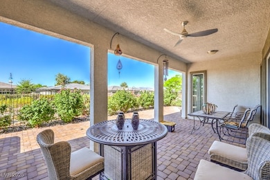View of patio with a fenced backyard, a ceiling fa