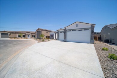 Ranch-style house featuring a garage and cooling u