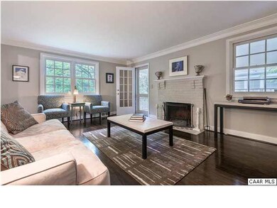 Living room with fireplace, door to covered side p