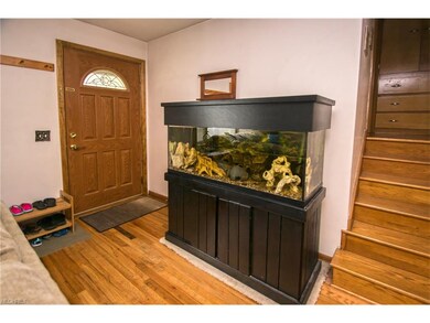 Spacious entry with beautiful wood floors leading 