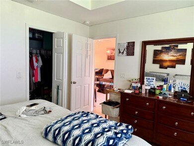 Bedroom featuring a closet and tile patterned floo
