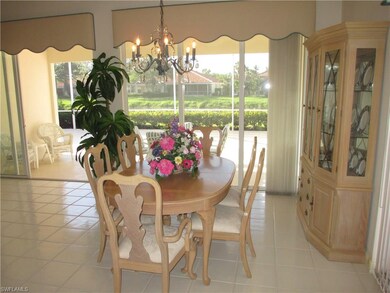 Dining area enjoys patio and lake views