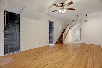 Entrance showing the living/dining area and stairs