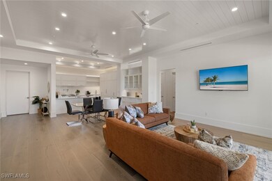 Living room with recessed lighting, light wood-sty