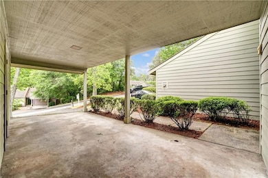 View of patio with an attached carport